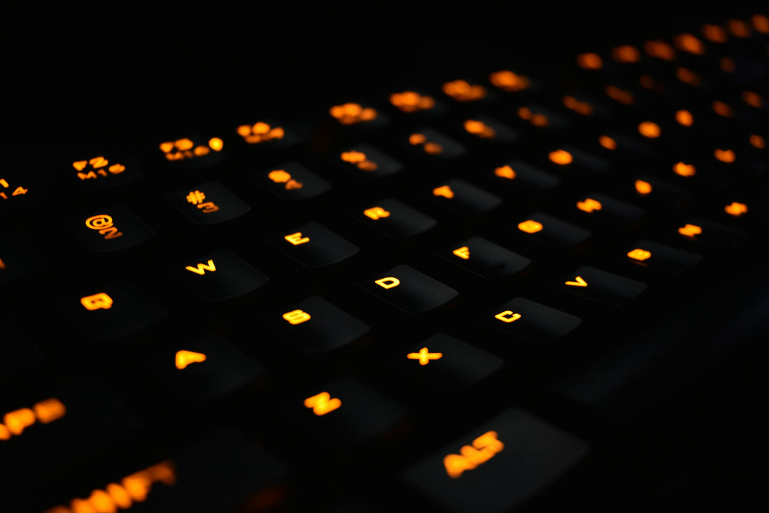 Close-up of a mechanical gaming keyboard with backlit keycaps