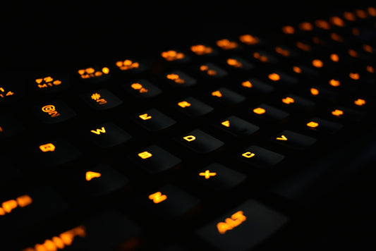 Close-up of a mechanical gaming keyboard with backlit keycaps